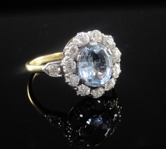 A mid 20th century aquamarine and diamond oval cluster ring, by Tiffany & Co, size M.